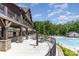 A charming outdoor patio area with tables, perfect for enjoying the scenic pool views at 1552 Trentwood Dr, Fort Mill, SC 29715