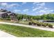 Scenic view of a clubhouse, pool, and tennis courts, all surrounded by lush greenery at 1552 Trentwood Dr, Fort Mill, SC 29715
