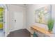 Bright entryway with dark wood floors, console table, and a vibrant art piece, with an open doorway to the left at 1552 Trentwood Dr, Fort Mill, SC 29715