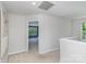 Bright hallway leading to a bedroom, showcasing neutral walls and plush carpeting throughout at 1552 Trentwood Dr, Fort Mill, SC 29715