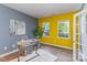 Bright office with grey and yellow walls, natural light, and a cozy work space at 1552 Trentwood Dr, Fort Mill, SC 29715