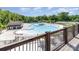 An aerial view of a beautiful pool area with multiple pools, a clubhouse, and tennis courts at 1552 Trentwood Dr, Fort Mill, SC 29715