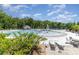 A Gathering-friendly pool area featuring multiple pools, seating, and lush landscaping at 1552 Trentwood Dr, Fort Mill, SC 29715