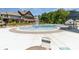 A luxurious pool area with an artistic water feature, and surrounding amenities at 1552 Trentwood Dr, Fort Mill, SC 29715