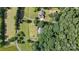 An aerial view of a luxurious property, with mature trees, surrounded by acreage at 15546 Thompson Rd, Mint Hill, NC 28227