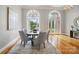 Dining room with large windows and modern chandelier at 15546 Thompson Rd, Mint Hill, NC 28227