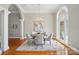 Dining room with chandelier, large windows, and hardwood floors at 15546 Thompson Rd, Mint Hill, NC 28227