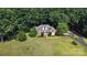 Sprawling brick home set on a large lush lot surrounded by mature trees at 15546 Thompson Rd, Mint Hill, NC 28227