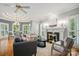 Inviting living room with fireplace, hardwood floors, and stylish decor, blending comfort and elegance at 15546 Thompson Rd, Mint Hill, NC 28227
