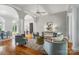 Bright and airy living room with hardwood floors, stylish seating, and sophisticated architectural details at 15546 Thompson Rd, Mint Hill, NC 28227