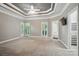 Large main bedroom with tray ceiling, plantation shutters, and an en-suite bathroom at 15546 Thompson Rd, Mint Hill, NC 28227