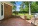 Brick patio with brick wall and view of backyard at 15546 Thompson Rd, Mint Hill, NC 28227