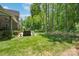 Spacious, green backyard with a grill and lush greenery, offering a serene outdoor setting at 1959 Landry Ln, Rock Hill, SC 29732