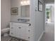 Bathroom featuring white cabinets, blue countertop, decorative mirror and a toilet at 1959 Landry Ln, Rock Hill, SC 29732