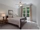 Comfortable bedroom featuring a queen bed, ceiling fan and a window with curtains at 1959 Landry Ln, Rock Hill, SC 29732
