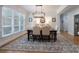 Dining room features a large rug, modern chandelier, and natural lighting at 1959 Landry Ln, Rock Hill, SC 29732