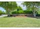 Meadow Lakes neighborhood entrance with brick signage, manicured landscaping, and mature trees at 1959 Landry Ln, Rock Hill, SC 29732