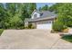 Home featuring a wide driveway and a two-car garage surrounded by manicured landscaping at 1959 Landry Ln, Rock Hill, SC 29732