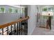 Upstairs hallway featuring a stone fireplace, hardwood floors and natural lighting at 1959 Landry Ln, Rock Hill, SC 29732