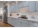 Gray kitchen with stainless steel refrigerator, modern cabinetry, quartz countertops, and tile backsplash at 1959 Landry Ln, Rock Hill, SC 29732