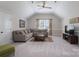 Living room featuring an L-shaped couch, flat screen tv, ceiling fan and a window at 1959 Landry Ln, Rock Hill, SC 29732