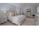 Spacious main bedroom with vaulted ceiling, neutral decor, a ceiling fan and ensuite bathroom at 1959 Landry Ln, Rock Hill, SC 29732
