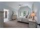 Bright main bedroom with vaulted ceiling, neutral decor and a bay window sitting area at 1959 Landry Ln, Rock Hill, SC 29732