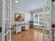 Bright home office featuring hardwood floors, french doors, and large window at 1959 Landry Ln, Rock Hill, SC 29732