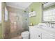 Modern bathroom with a glass-enclosed shower, white vanity, and stylish fixtures at 2100 Stonewood Dr, Charlotte, NC 28210