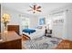Cozy bedroom with hardwood floors, neutral decor, and ample natural light at 2100 Stonewood Dr, Charlotte, NC 28210