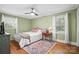 Comfortable bedroom with hardwood floors, a ceiling fan, and lots of natural light at 2100 Stonewood Dr, Charlotte, NC 28210
