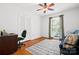 Bright bedroom with a ceiling fan, large window, wood floors and a neutral color scheme at 2100 Stonewood Dr, Charlotte, NC 28210