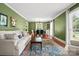 Bright living room with hardwood floors, large windows, and a comfortable seating area at 2100 Stonewood Dr, Charlotte, NC 28210
