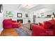 Inviting living room with a brick fireplace, white walls and views of the kitchen at 2100 Stonewood Dr, Charlotte, NC 28210
