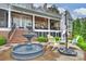 Backyard with brick stairs, water fountain feature, seating area, and a view of the lake at 299 Barber Loop, Mooresville, NC 28117
