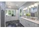 This stylish bathroom has gray marble floors, white cabinets, and a large shower area at 299 Barber Loop, Mooresville, NC 28117