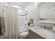 This bathroom has a shower-tub combo, marble counters, and neutral finishes at 299 Barber Loop, Mooresville, NC 28117