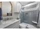 Elegant bathroom features a marble vanity, and a walk-in shower with stylish gray tile and glass door at 299 Barber Loop, Mooresville, NC 28117