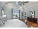 This primary bedroom has hardwood floors, many windows, and a peaceful sitting area at 299 Barber Loop, Mooresville, NC 28117