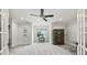 Bright bonus room with neutral carpet, a ceiling fan, large windows and a view of the lake at 299 Barber Loop, Mooresville, NC 28117