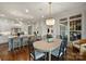 Charming dining area with chandelier lighting next to an expansive kitchen space at 299 Barber Loop, Mooresville, NC 28117