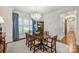 Elegant dining room featuring classic decor, ample seating, and abundant natural light through large windows at 299 Barber Loop, Mooresville, NC 28117