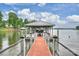 Beautiful view of a covered dock with boat lift on the water showcasing sturdy construction and a prime waterfront location at 299 Barber Loop, Mooresville, NC 28117