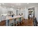 Elegant kitchen with open layout, marble island, and seamless flow to the living area at 299 Barber Loop, Mooresville, NC 28117