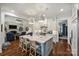 Open-concept kitchen flowing into a bright living area and dining space at 299 Barber Loop, Mooresville, NC 28117
