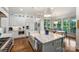 Spacious gourmet kitchen with large center island, farmhouse sink, and pendant lighting at 299 Barber Loop, Mooresville, NC 28117