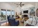 Stylish living room with a lake view, built-in shelving, and a brick fireplace at 299 Barber Loop, Mooresville, NC 28117