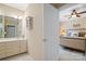 Bathroom featuring a sink and cabinet, across from a bedroom at 3420 Maryhurst Ln, Charlotte, NC 28226
