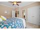 Comfortable bedroom with a ceiling fan, two closets, and neutral walls at 3420 Maryhurst Ln, Charlotte, NC 28226