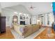 Bright and airy living room featuring a cozy sectional sofa, fireplace, and backyard views at 3420 Maryhurst Ln, Charlotte, NC 28226